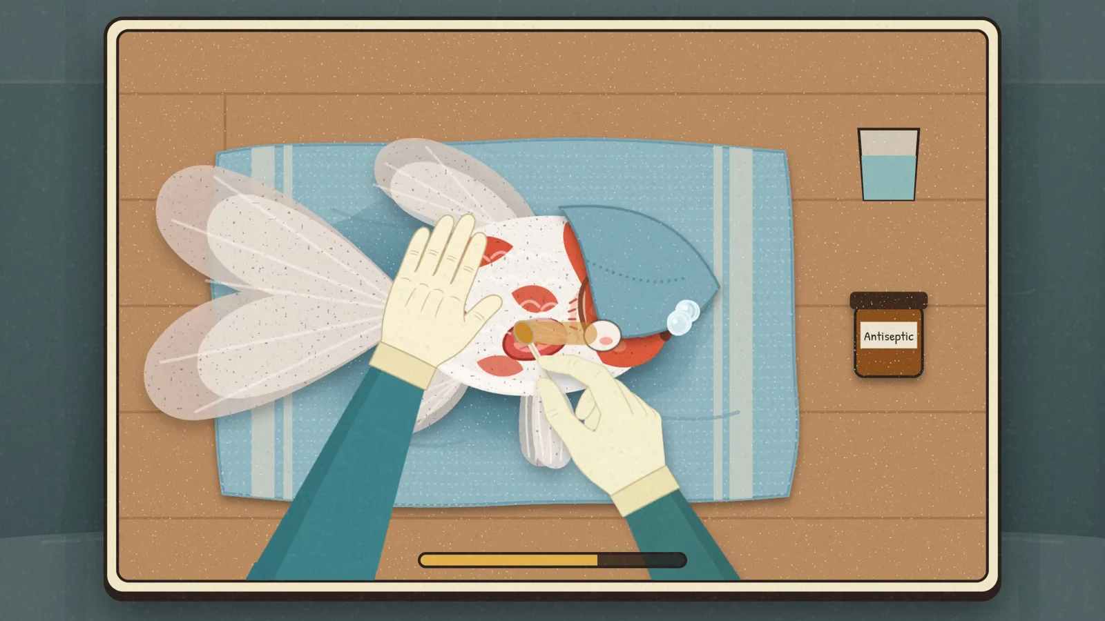 Gloved hands steady a goldfish on a wet towel and clean its wound with a cotton swab